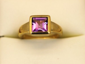 AN AMETHYST SET RING