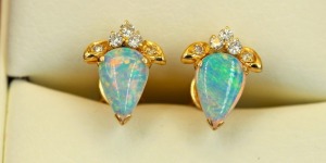 A PAIR OF VINTAGE OPAL AND DIAMOND EARRINGS