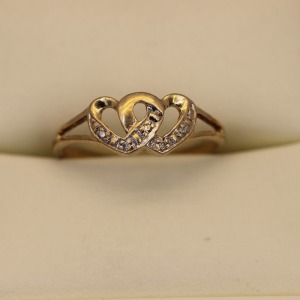 AN ANTIQUE DIAMOND SET WITCHES HEART RING