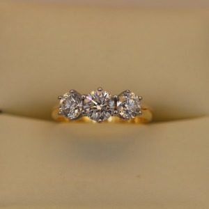 A THREE STONE DIAMOND RING