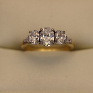 A THREE STONE DIAMOND RING