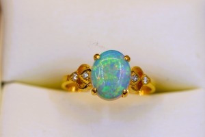 A VINTAGE OPAL AND DIAMOND RING