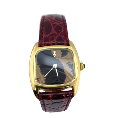 A LADY'S CORUM GOLD 'FEATHER' WRISTWATCH