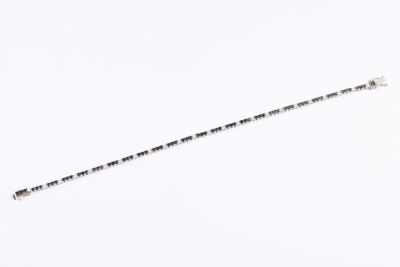 A BLACK AND WHITE DIAMOND LINE BRACELET